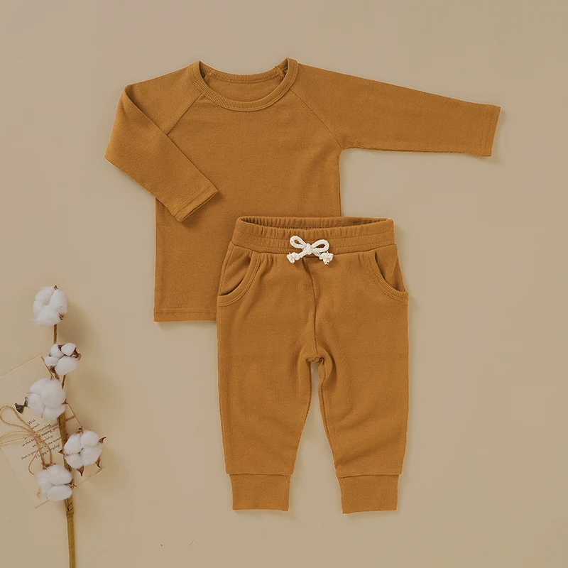 Eco-friendly bamboo baby sleepers displayed for wholesale buyers, showcasing sustainable, soft, and hypoallergenic fabric ideal for retail stores.