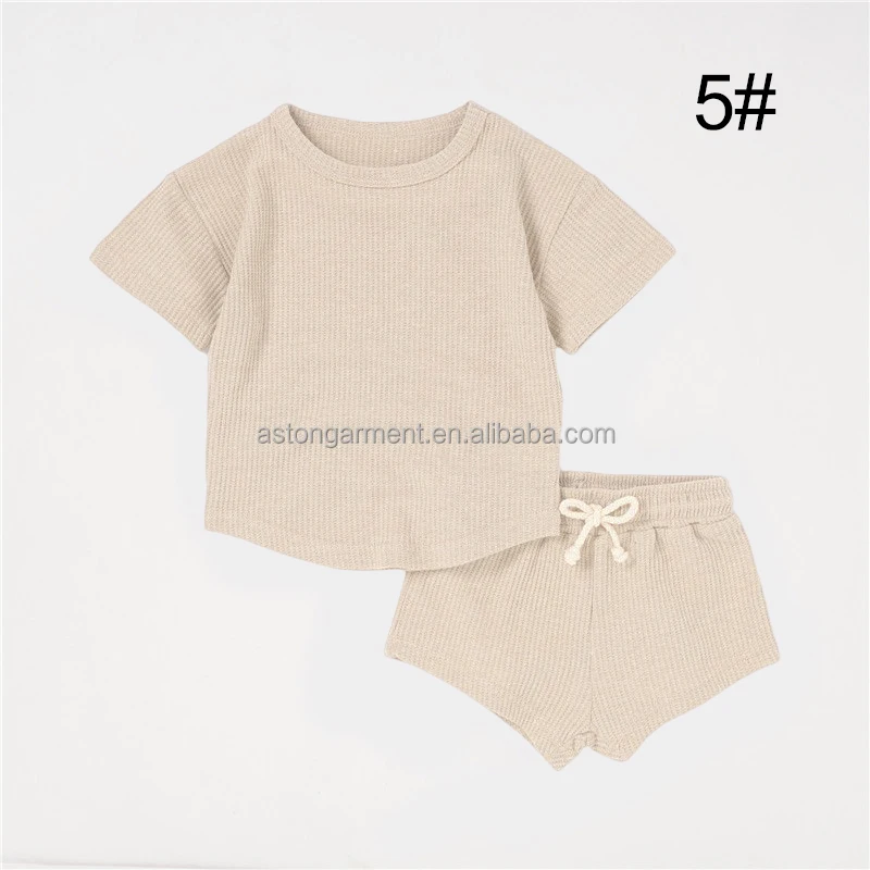 Soft, eco-friendly bamboo baby clothes displayed for wholesale buyers, perfect for sustainable infant apparel businesses seeking quality and comfort.
