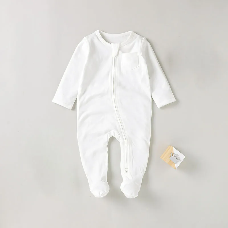 Soft bamboo sleepsuit displayed on a hanger, showcasing sustainable babywear ideal for B2B wholesale buyers seeking eco-friendly products.